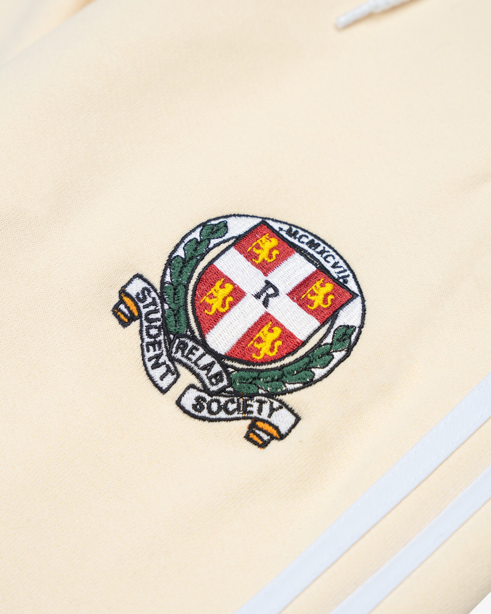 BEIGE FLARED EMBLEM SWEATPANTS